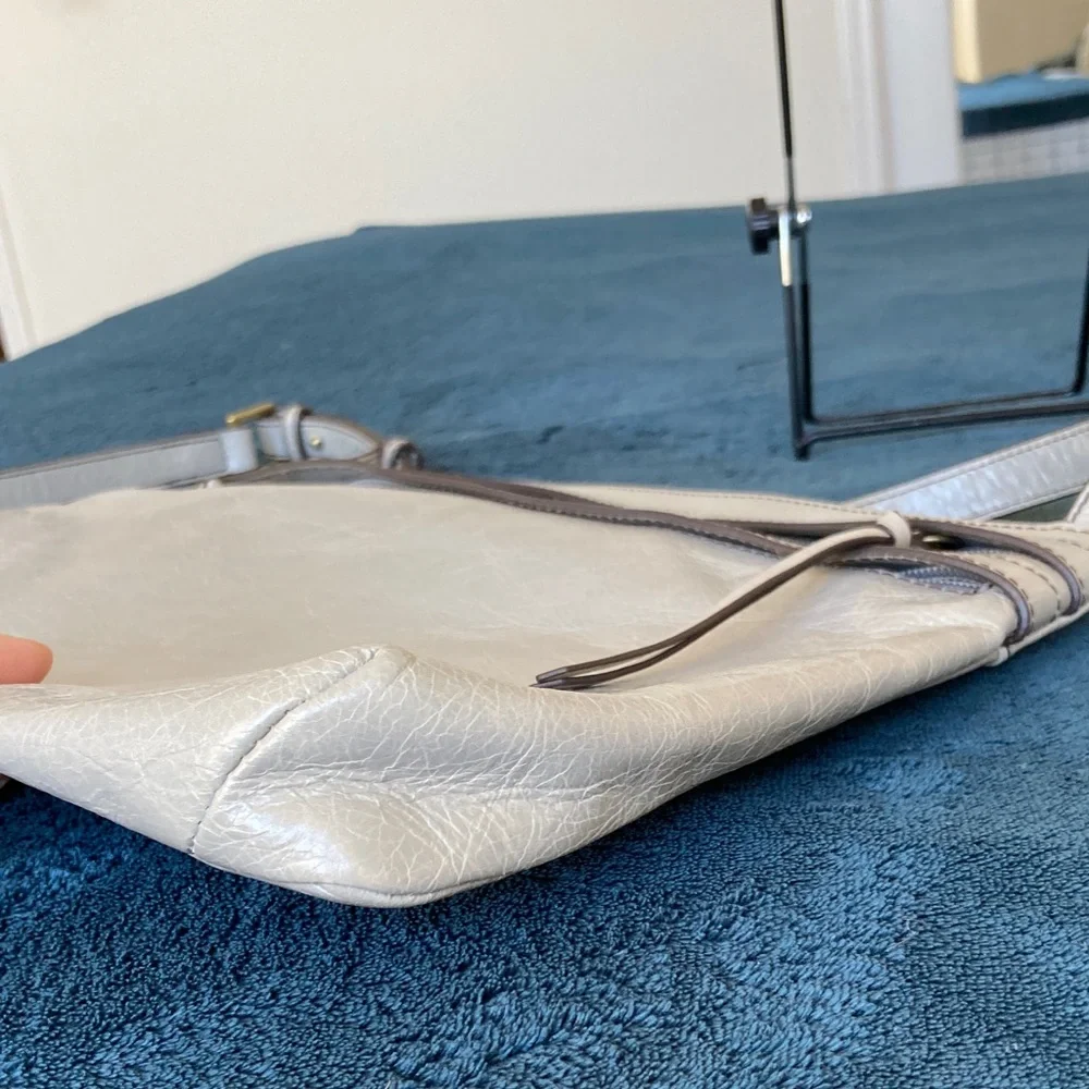 Hobo Larkin crossbody bag in a gray distressed leather